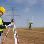 Land Surveyor working in a field