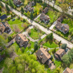 Aerial photo of village of Houses Residential Drone Above View Summer Blue Sky Estate Agent