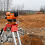 Photo of a level at the background of construction site on the street.