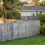wooden fence for back yard protection and privacy. timber plank fencing in florida